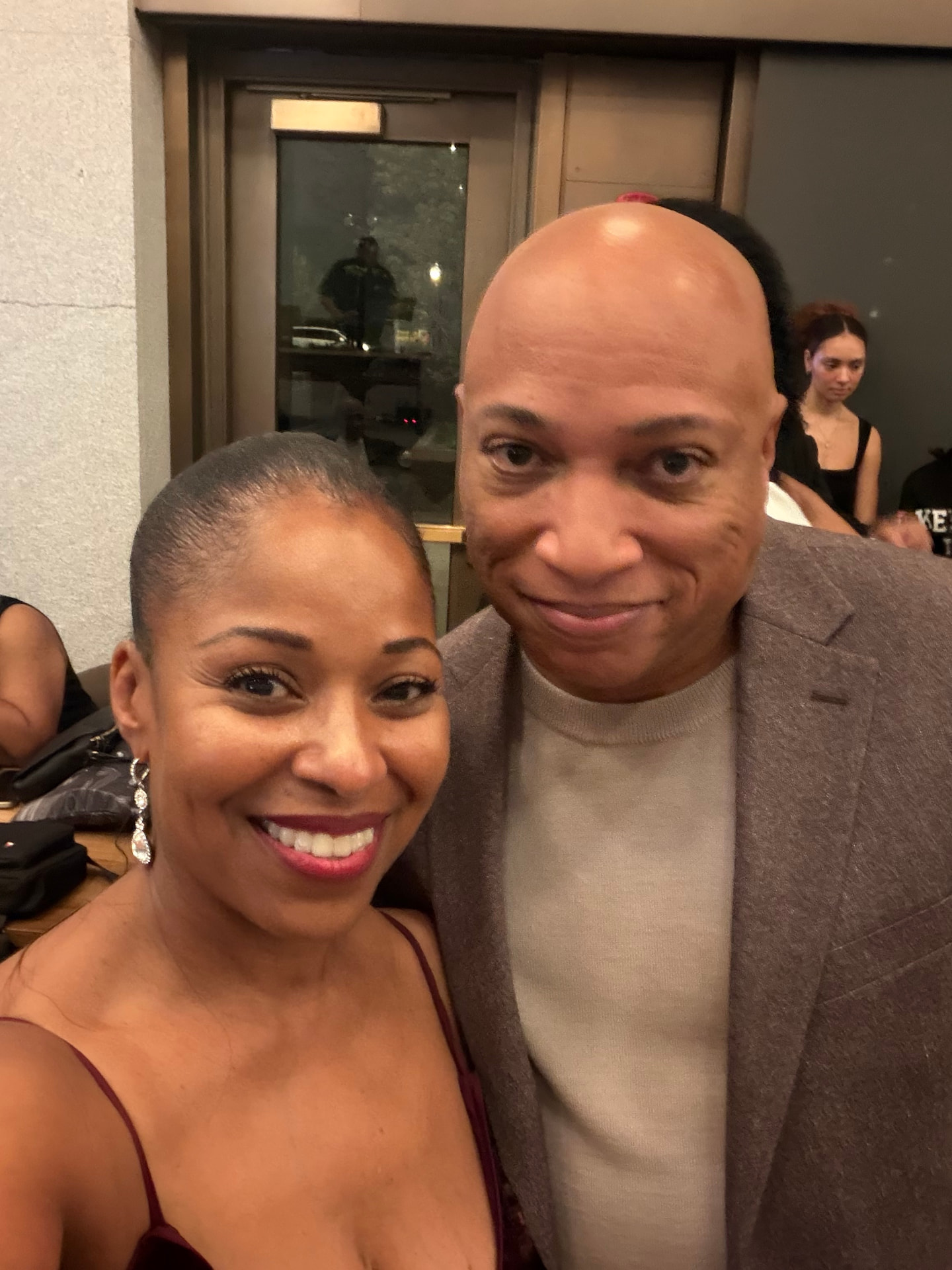 Two guests smiling together in a selfie