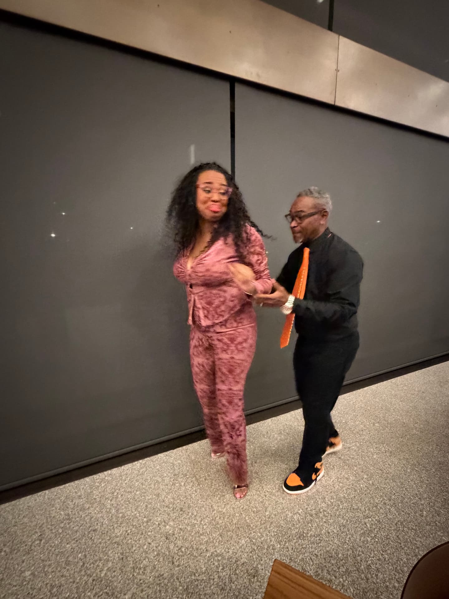 The choir director dancing with a guest at the reception