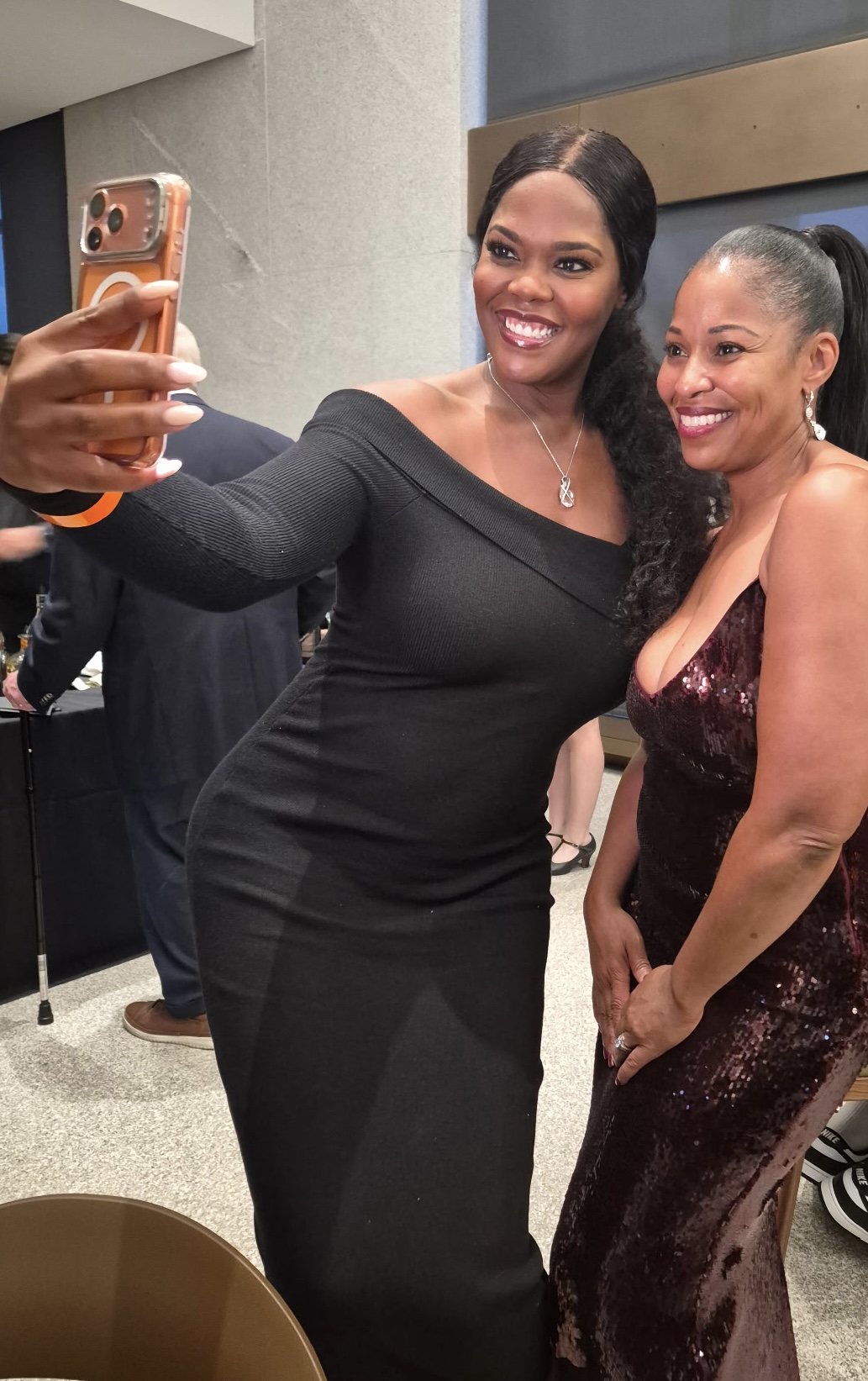 Two guests taking a selfie at the reception